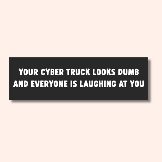 Introducing the Ghost Poppy “You Look Dumb Car Magnet”—a black rectangular magnet crafted from heavy-duty, weatherproof magnetic material. It features bold white text reading “YOUR CYBER TRUCK LOOKS DUMB AND EVERYONE IS LAUGHING AT YOU,” making it the perfect statement accessory for any vehicle.