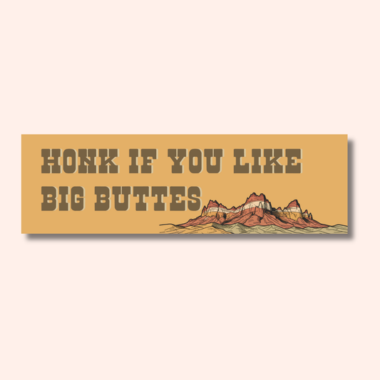Weatherproof rectangular I Like Big Buttes car magnet featuring the text HONK IF YOU LIKE BIG BUTTES next to an illustration of a desert butte.