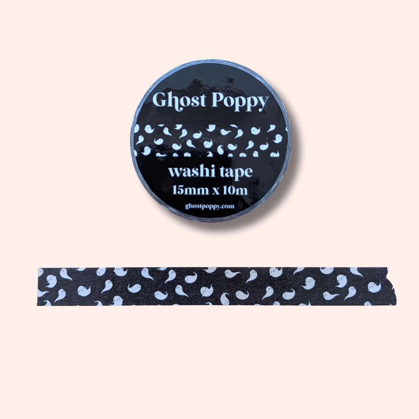Ghost Parade Washi Tape by Ghost Poppy features small white ghost patterns—perfect for adding a touch of spooky stationery to your collection. The tape roll is pictured above a strip of the unrolled washi tape, clearly displaying the repeating ghost design.