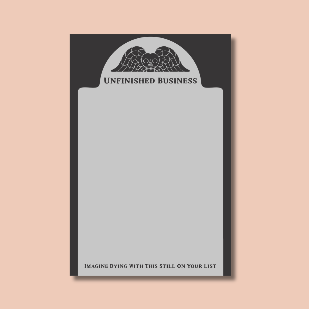 The Unfinished Business Notepad by Ghost Poppy is a quirky, tombstone-shaped 4x6 notepad featuring an angel illustration and titled “UNFINISHED BUSINESS.” It includes 50 sheets, with the phrase “IMAGINE DYING WITH THIS STILL ON YOUR LIST” printed at the bottom.